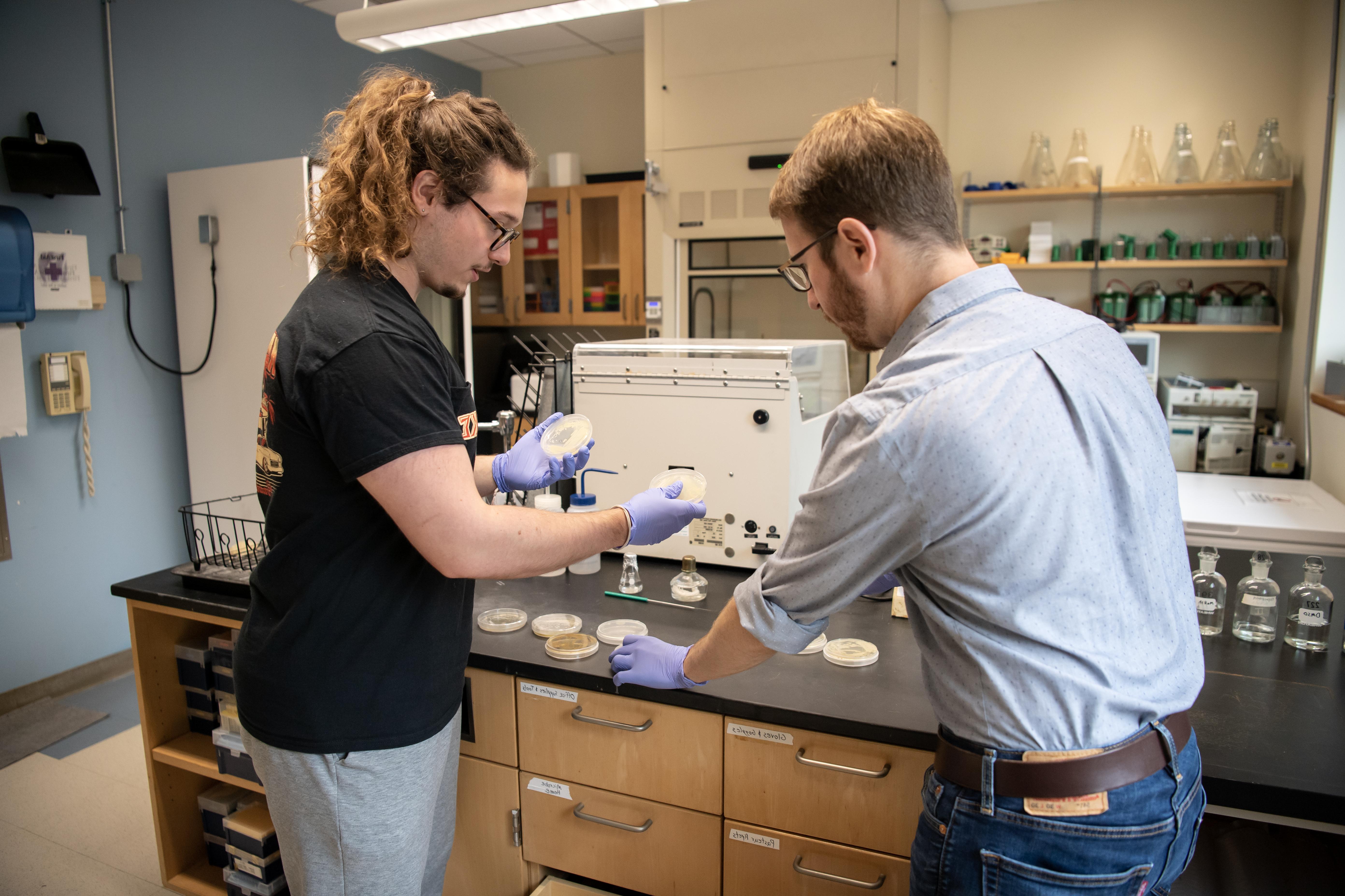 Estes and May working in lab